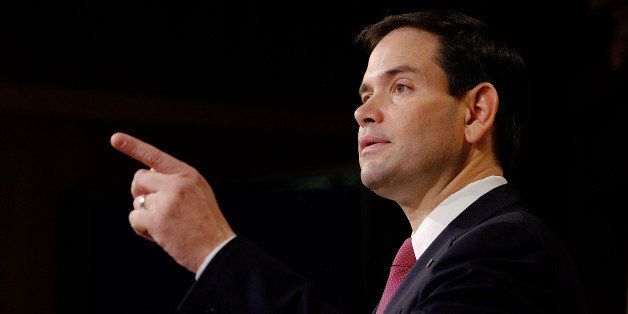 WASHINGTON, DC - DECEMBER 17: Sen. Marco Rubio (R-FL) reacts to U.S. President Barack Obama's announcement about revising policies on U.S.-Cuba relations on December 17, 2014 in Washington, DC. Rubio called the President a bad negotiator and criticized what he claimed was a deal with no democratic advances for Cuba. (Photo by T.J. Kirkpatrick/Getty Images)