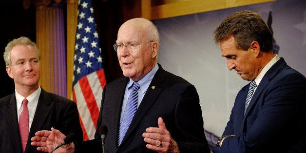 WASHINGTON, DC - DECEMBER 17: Sen. Patrick Leahy (D-VT) (C), Sen. Jeff Flake (R-AZ) (R) and Rep. Chris Van Hollen (D-MD) (L), talk about their efforts to retrieve U.S. contractor Alan Gross from prison in Cuba on December 17, 2014 in Washington, DC. The three lawmakers flew to Cuba to bring Gross, held in Cuba since 2009, back to the United States. U.S. President Barack Obama announced today plans to restore diplomatic relations with Cuba, over 50 years after they were severed in January 1961. (Photo by T.J. Kirkpatrick/Getty Images)