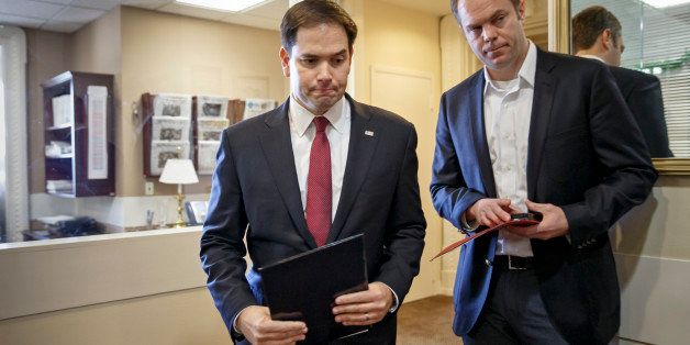 Sen. Marco Rubio, R-Fla., the son of Cuban immigrants, arrives for a news conference where he expressed his disappointment in President Barack Obama's initiative to normalize relations between the United States and Cuba, at the Capitol in Washington, Wednesday, Dec. 17, 2014. (AP Photo/J. Scott Applewhite)