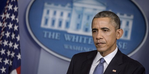 US President Barack Obama speaks during a press conference in the briefing room of the White House December 19, 2014 in Washington, DC. Obama addressed the press before traveling with the first family on their annual Christmas beach vacation in the president's birth state of Hawaii. Obama on Friday warned North Korea it would face retaliation over a cyber attack on Sony Pictures and pledged not to bow to dictators, as an envoy for Pyongyang denied involvement. AFP PHOTO/BRENDAN SMIALOWSKI (Photo credit should read BRENDAN SMIALOWSKI/AFP/Getty Images)