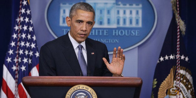 WASHINGTON, DC - DECEMBER 19: U.S. President Barack Obama pauses during his speech to members of the media during his last news conference of the year in the James Brady Press Briefing Room of the White House December 19, 2014 in Washington, DC. President Obama faced questions on various topics including the changing of Cuba policy, the computer hack of Sony by North Korea, his executive action on immigration and his plan on working with a Republican majority Congress. (Photo by Alex Wong/Getty Images)