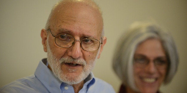 WASHINGTON, DC - DECEMBER 17: Alan Gross, accompanied by his wife Judy, speaks to reporters during a press conference at the law offices of Gilbert LLP in Washington, D.C., December 17, 2014. Gross recently returned home to the United States after spending five years in a Cuban prison. (Photo by Astrid Riecken For The Washington Post via Getty Images)