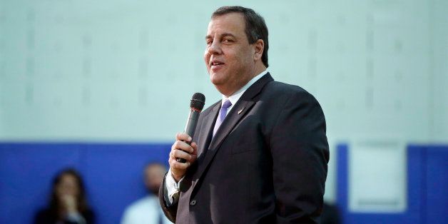 New Jersey Gov. Chris Christie pauses while addressing students, teachers and parents at Mendham Township Middle School Wednesday, Dec. 17, 2014, in Mendham Township, N.J., after a student asked if he was going to run for President. Christie said that he was still deciding and planned to make his decision early next year. (AP Photo/Mel Evans)