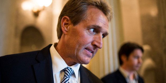 UNITED STATES - JUNE 10: Sen. Jeff Flake, R-Ariz., speaks with a reporter as he leaves the Senate floor on Tuesday, June 10, 2014. (Photo By Bill Clark/CQ Roll Call)