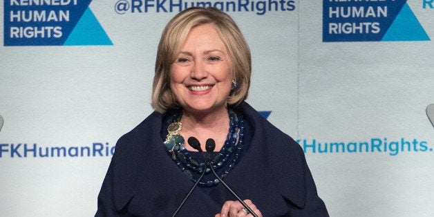 NEW YORK, NY - DECEMBER 16: Event honoree Hillary Rodham Clinton speaks on stage during the 2014 Robert F. Kennedy Ripple Of Hope Awards at the New York Hilton on December 16, 2014 in New York City. (Photo by Mike Pont/FilmMagic)