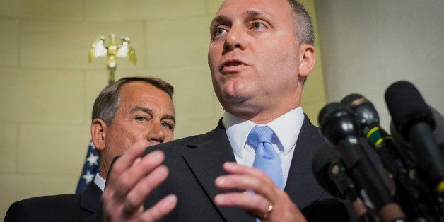 Representative Steve Scalise, a Republican from Louisiana, right, speaks during a news conference while House Speaker John Boehner listens, following a House leadership election on Capitol Hill in Washington, D.C., U.S., on Thursday, June 19, 2014. Republicans elected McCarthy as U.S. House majority leader, promoting a member of Speaker John Boehner's leadership team seen as a friend to business and Wall Street, and chose Scalise to succeed McCarthy as majority whip. Photographer: Pete Marovich/Bloomberg via Getty Images 