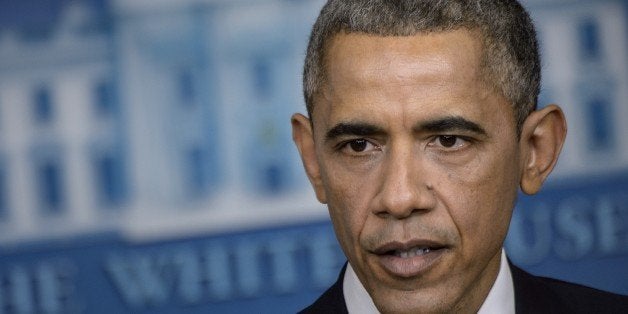 US President Barack Obama speaks during a press conference in the briefing room of the White House December 19, 2014 in Washi