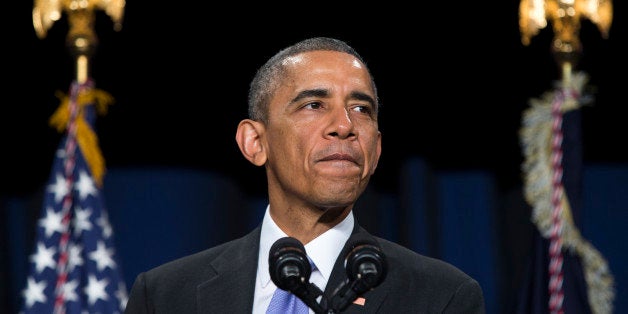 President Barack Obama pauses as he speaks about the Senior Executive Service, composed of the senior leadership of the Federal workforce, Tuesday, Dec. 9, 2014, in Washington. Obama is launching a leadership program for future government career executives with a goal of giving potential managers multi-agency experiences and breaking out of a tradition of promoting senior bureaucrats from within their own agencies. (AP Photo/Evan Vucci)