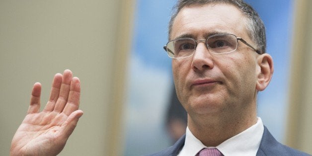 Jonathan Gruber, an economics professor at Massachusetts Institute of Technology (MIT) and a consultant on the drafting of the Affordable Care Act legislation known as 'Obamacare,' takes the oath prior to testifying during a US House Committee on Oversight and Government Reform hearing on Capitol Hill in Washington, DC, December 9, 2014. AFP PHOTO / SAUL LOEB (Photo credit should read SAUL LOEB/AFP/Getty Images)