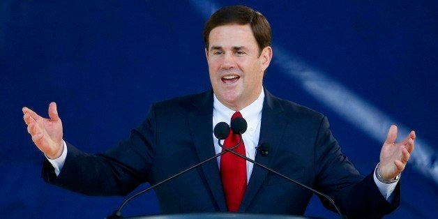 Republican Arizona Gov. Doug Ducey addresses the crowd after being sworn in during inauguration ceremonies at the Arizona Capitol Monday, Jan. 5, 2015, in Phoenix. (AP Photo/Ross D. Franklin)