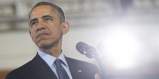 US President Barack Obama speaks to US troops at Joint Base McGuire-Dix-Lakehurst in New Jersey, December 15, 2014. AFP PHOTO / SAUL LOEB (Photo credit should read SAUL LOEB/AFP/Getty Images)