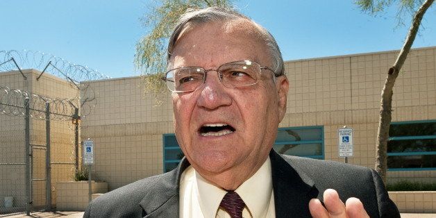 (FILES) Maricopa County Sheriff Joe Arpaio speaks with a reporter outside city jail in this May 3, 2010, file photo. The US Justice Department on May 10, 2012 sued Arpaio, his office and the county over civil rights violations involving racial profiling. AFP Photo/Paul J. Richards/FILES (Photo credit should read PAUL J. RICHARDS/AFP/GettyImages)