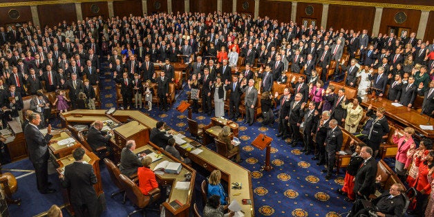 WASHINGTON, DC - JANUARY 6:
House Speaker John Boehner(R-OH), left, administers the oath to House members on opening day of