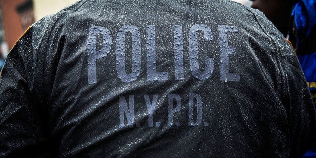 NEW YORK, NY - FEBRUARY 23: New York Police Department officers monitor a march against stop-and-frisk tactics used by polic