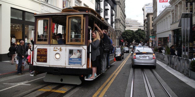 View of a cable car on Powell Street as it crosses the intersection with O'Farrell, San Francisco, California, July 16, 2014. (Photo by Dan Porges/Getty Images)