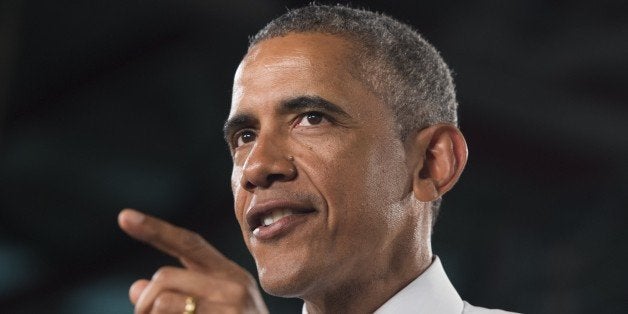 US President Barack Obama speaks about the automotive manufacturing industry at the Ford Michigan Assembly Plant in Wayne, Michigan, January 7, 2015. AFP PHOTO / SAUL LOEB (Photo credit should read SAUL LOEB/AFP/Getty Images)