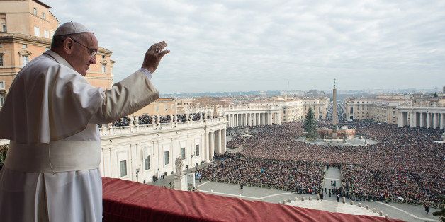 In this picture provided by the Vatican newspaper L'Osservatore Romano, Pope Francis delivers his "Urbi et Orbi" (to the city and to the world) blessing from the central balcony of St. Peter's Basilica at the Vatican, Thursday, Dec. 25, 2014. Tens of thousands of Romans and tourists in St. Peter's Square listened as the pontiff delivered the Catholic church's traditional Christmas message from the central balcony of St. Peter's Basilica. Pope Francis focused his concern Thursday on those weeping in the world this Christmas, singling out refugees, hostages and others suffering in the Middle East, Africa and Ukraine as he prayed for hope and peace. (AP Photo/L'Osservatore Romano)