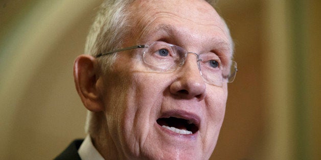 Senate Majority Leader Harry Reid of Nev. speaks with reporters following a closed-door policy meeting on Capitol Hill in Washington, Tuesday, Dec. 2, 2014. (AP Photo/J. Scott Applewhite)