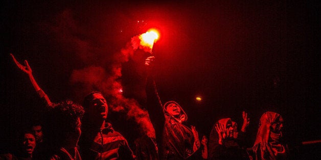 CAIRO, EGYPT - JANUARY 8: A group of people who call themselves anti-coup demonstrators, stage a protest in the Helmeyat el Zeytun district of Cairo, Egypt on January 8, 2015. (Photo by Stringer/Anadolu Agency/Getty Images)