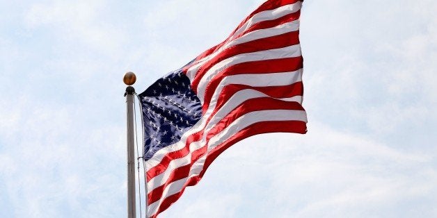 MILWAUKEE - SEPTEMBER 20: An American Flag flies outside the US Bank Center on September 20, 2014 in Milwaukee, Wisconsin. (Photo By Raymond Boyd/Getty Images)