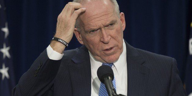 Director of Central Intelligence Agency John Brennan takes questions from reporters during a press conference at CIA headquarters in Langley, Virginia, December 11, 2014. The head of the Central Intelligence Agency acknowledged Thursday some agency interrogators used 'abhorrent' unauthorized techniques in questioning terrorism suspects after the 9/11 attacks. CIA director John Brennan said there was no way to determine whether the methods used produced useful intelligence, but he strongly denied the CIA misled the public. AFP PHOTO/JIM WATSON (Photo credit should read JIM WATSON/AFP/Getty Images)