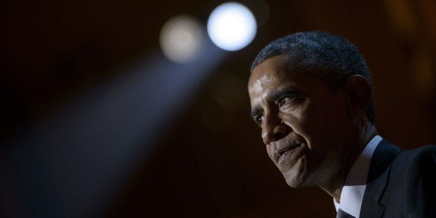 US President Barack Obama speaks during a taping of the Christmas in Washington concert at the National Building Museum December 14, 2014 in Washington, DC. Obama and the first family attended the charity concert to benefit the Children's National Medical Center. AFP PHOTO/BRENDAN SMIALOWSKI (Photo credit should read BRENDAN SMIALOWSKI/AFP/Getty Images)