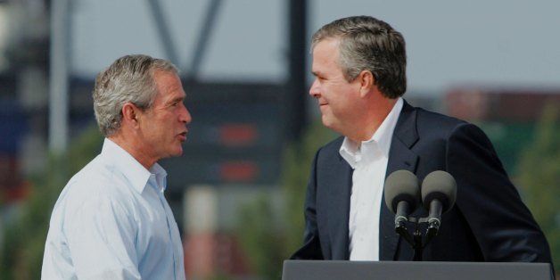 MIAMI - JULY 31: U.S. President George W. Bush (L) and his brother, Florida Governor Jeb Bush (R), shake hands during a visit to the U.S. Coast Guard station July 31, 2006 in Miami, Florida. The president was visiting the U.S. Coast Guard station during a swing through the Miami area to meet with local politicians and businesspeople. (Photo by Joe Raedle/Getty Images)
