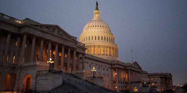 Orange cones surround the Capitol building stands at dusk before U.S. President Barack Obama delivers the State of the Union address to a joint session of Congress in Washington, D.C., U.S., on Tuesday, Jan. 28, 2014. Obama tonight will say the U.S. must break the economic stagnation of lower- and middle-income Americans, calling on Congress to work with him on 'concrete, practical proposals' while vowing to act on his own wherever he can. Photographer: Pete Marovich/Bloomberg via Getty Images