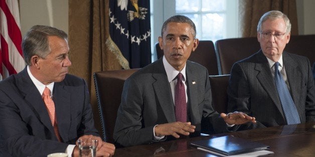 US President Barack Obama (C) speaks alongside Speaker of the House John Boehner (L), Republican of Ohio, and Senate Majority Leader Mitch McConnell (R), Republican of Kentucky, prior to a meeting of the bipartisan, bicameral leadership of Congress in the Cabinet Room at the White House in Washington, DC, January 13, 2015. AFP PHOTO / SAUL LOEB (Photo credit should read SAUL LOEB/AFP/Getty Images)