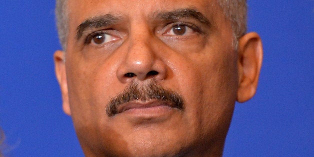 PARIS, FRANCE - JANUARY 11: United States Attorney General Eric Holder attends a press conference in the presence of the other interior ministers after their meeting in the ministry of interior Place Beauvau on January 11, 2015 in Paris, France. The ministers will all join the mass unity rally held in Paris following recent terrorist attacks (Photo by Aurelien Meunier/Getty Images)