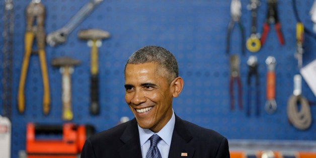 President Barack Obama smiles as he speaks at Cedar Falls Utilities, Wednesday, Jan. 14, 2015, in Cedar Falls, Iowa. Presiden