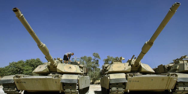 BAGHDAD, Iraq: A US soldier of Delta Company, Task Force 4-64 Armor, works on the M1 Abrams Tanks at Camp Prosperity, in Baghdad's fortified Green Zone 31 August 2005. Up to 650 people were crushed to death or drowned in a stampede on a Baghdad bridge triggered by fears a suicide bomber was among vast crowds of Shiite pilgrims massed for a religious ceremony. AFP PHOTO/LIU Jin (Photo credit should read LIU JIN/AFP/Getty Images)