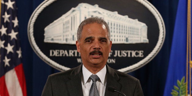 WASHINGTON, DC - DECEMBER 03: U.S. Attorney General Eric Holder speaks at the Justice Department December...