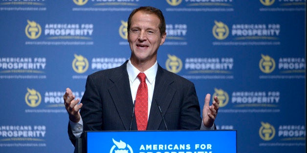 Americans for Prosperity Foundation President Tim Phillips addresses attendees of the Defending the American Dream Summit in Orlando, Fla., Friday, Aug. 30, 2013.(AP Photo/Phelan M. Ebenhack)