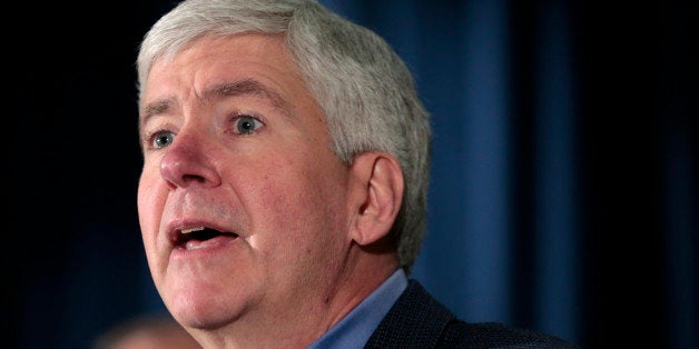 Rick Snyder, governor of Michigan, speaks during a news conference at police headquarters in Detroit, Michigan, U.S., on Wednesday, Dec. 10, 2014. Detroit asked to end its record $18 billion municipal bankruptcy, a request that may be fulfilled by days end. Photographer: Jeff Kowalsky/Bloomberg via Getty Images 