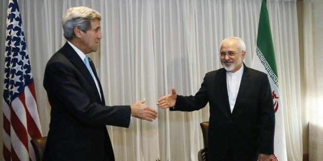 Iranian Foreign Minister Mohammad Javad Zarif (R) shakes hands on January 14, 2015 with US State Secretary John Kerry in Geneva. Zarif said on January 14 that his meeting with his US counterpart was vital for progress on talks on Tehran's contested nuclear drive. Under an interim deal agreed in November 2013, Iran's stock of fissile material has been diluted from 20 percent enriched uranium to five percent, in exchange for limited sanctions relief. AFP PHOTO / POOL / RICK WILKING (Photo credit should read RICK WILKING/AFP/Getty Images)