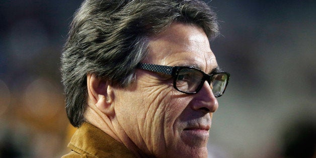 COLLEGE STATION, TX - NOVEMBER 27: Governor Rick Perry of Texas waits on the field prior to the start of the game between th
