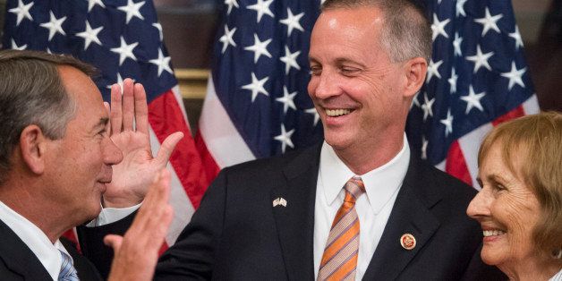 UNITED STATES - JUNE 25: From left, Speaker of the House John Boehner, Rep.-elect Curt Clawson, R-Fla., and his mother Cherie Clawson participate in the ceremonial swearing-in photo opportunity in the Capitol on Wednesday, June 25, 2014. (Photo By Bill Clark/CQ Roll Call)