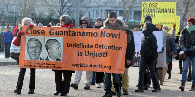 WASHINGTON, DC - JANUARY 11: Protesters rally outside of the White House to protest Guantanamo Bay on the 13th anniversary of the first prisoners arriving at the detention facility, in Washington, DC on January 11, 2015. (Photo by Erkan Avci/Anadolu Agency/Getty Images)