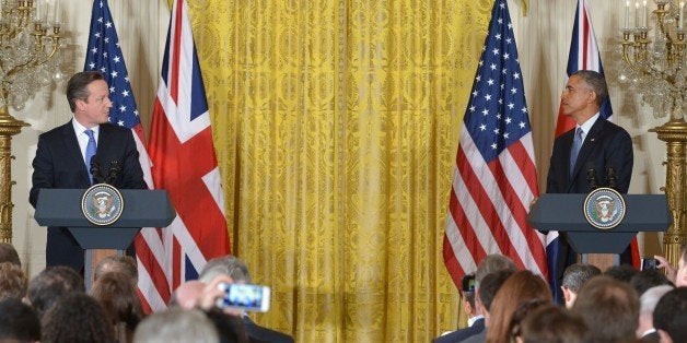 US President Barack Obama (R) and Britain's Prime Minister David Cameron hold a press conference in the East Room of the Whit
