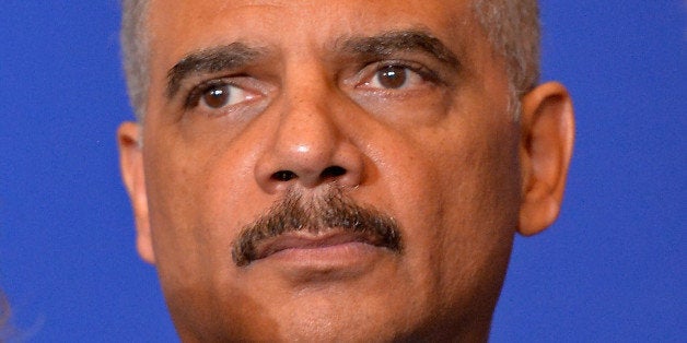 PARIS, FRANCE - JANUARY 11: United States Attorney General Eric Holder attends a press conference in the presence of the other interior ministers after their meeting in the ministry of interior Place Beauvau on January 11, 2015 in Paris, France. The ministers will all join the mass unity rally held in Paris following recent terrorist attacks (Photo by Aurelien Meunier/Getty Images)