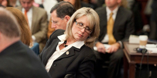 UNITED STATES - FEBRUARY 01: Rep. Renee Ellmers, R-N.C., talks with an aide off camera during bipartisan, bicameral hearing of conferees in the Capitol Visitor Center to reach an agreement on a year-long payroll tax cut extension. (Photo By Tom Williams/CQ Roll Call)