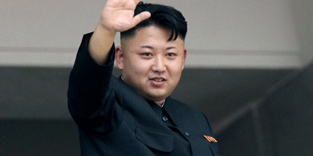 FILE - In this July 27, 2013 file photo, North Korea's leader Kim Jong Un waves to spectators and participants of a mass military parade celebrating the 60th anniversary of the Korean War armistice in Pyongyang, North Korea. If the U.S. governmentâs claim that North Korea was involved in the unprecedented hack attack on Sony Pictures that scuttled Seth Rogenâs latest comedy is correct, no one can say they werenât warned. The movie, âThe Interview,â pushed all of North Koreaâs buttons. (AP Photo/Wong Maye-E, File)