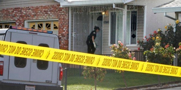 Crime scene tape is seen in front of the home Wednesday, Oct. 24, 2012, where a mother and her two young children were found murdered in Rancho Cordova, Calif. The woman and her 2-year-old son and 3-year-old daughter, were found dead by her husband when he came home from work. A suspect, 19-year-old Grigoriy Bukhantsov, the brother of the father was arrested as a suspect for the slayings. (AP Photo/Rich Pedroncelli)