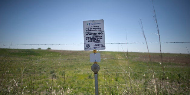 A sign marks the ground covering TransCanada's Keystone I pipeline outside of Steele City, Nebraska. The Keystone XL pipeline