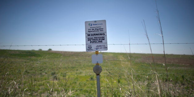 A sign marks the ground covering TransCanada's Keystone I pipeline outside of Steele City, Nebraska. The Keystone XL pipeline is set to meet the first pipeline at this location. From Oil and Water: Following the route of the Keystone XL pipeline through the USA. (Photo by Lucas Oleniuk/Toronto Star via Getty Images)