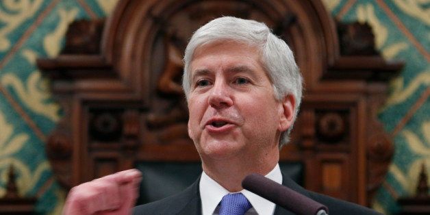Michigan Gov. Rick Snyder delivers his State of the State address to a joint session of the House and Senate, Tuesday, Jan. 20, 2015, at the state Capitol in Lansing, Mich. (AP Photo/Al Goldis)
