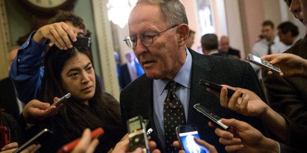 WASHINGTON, DC - OCTOBER 12: Sen. Lamar Alexander (R-TN) speaks to reporters before going into the Senate Chamber to vote, on October 12, 2013 in Washington, DC. The shut down is currently in it's 12th day. (Photo by Andrew Burton/Getty Images)