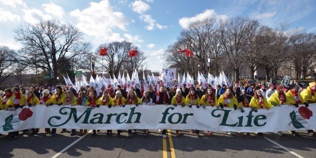 Anti-abortion activists take part in the annual 'March for Life' rally on January 22, 2015 in Washington DC. AFP PHOTO/MANDEL NGAN (Photo credit should read MANDEL NGAN/AFP/Getty Images)