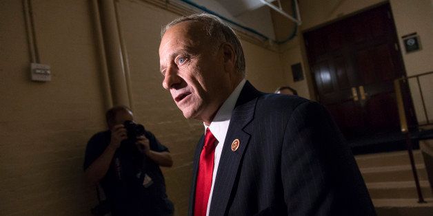 In this Sept. 28, 2013, photo, Rep. Steve King, R-Iowa, arrives for a closed-door meeting with fellow Republicans as the House of Representatives works into the night to pass a bill to fund the government, at the Capitol in Washington. The Republican Partyâs two Kings in Congress both voted against GOP leadersâ latest effort to prevent President Barack Obamaâs health care overhaul from becoming entrenched, but for opposite reasons. New York congressman Peter King says it was a mistake to link curbing âObamacareâ with averting a government shutdown. Iowa congressman King characterizes Boehnerâs measure to delay making millions of people buy health insurance for year as a retreat from defunding the new health care law entirely. (AP Photo/J. Scott Applewhite)